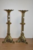 A pair of 19th Century gilt metal pricket candle stands of Gothic design, each measuring 40cm high