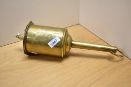A Victorian brass bottle jack, measuring 34cm long