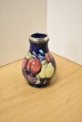 An early 20th Century Moorcroft vase, of ovoid form and decorated in the Wisteria pattern against