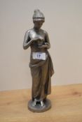 A 20th Century cast metal figural ornament depicting a goddess in drapery, measuring 26cm high