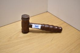 A 20th Century hardwood gavel with turned grip and measuring 18cm long