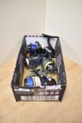 Four spinning reels - A Shakespeare Noris 2030, a Catcher 40, a Profish 100, and an Abu Cardinal