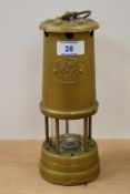 A vintage brass Cymru (Wales) miner's lamp, measuring 23cm high
