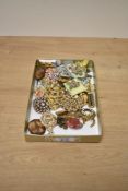 A selection of costume brooches, comprising large statement pieces, paste set examples and floral