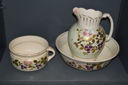 A late 19th Century toilet jug, bowl, and chamber pot, of Aesthetic Period design featuring floral
