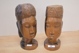 Two 20th Century African carved hardwood busts, each measuring 20cm high