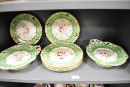 A small quantity of 19th Century Coalport style tableware, painted with botanical designs within