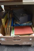 A selection of reading material, including Wine Buyers Guides, A History of Crusades, and others