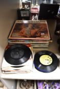 A selection of vintage LP records, including 'The Andy Williams Christmas Album', and various 45 RPM