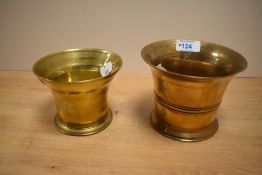 Two 19th Century brass mortars of typical turned form, one appears to be bell mortar, the largest