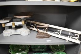 A set of early 20th Century cast iron scales painted in blue, measuring 33cm long, together with a