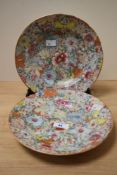 A pair of Chinese Millefiori Famille Rose plates, both painted with colourful flower heads, and