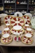 A selection of Victorian bone china teaware, in the Vienna style with gilt decoration on bands of