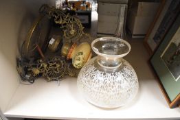 A late 19th Century hanging oil lamp, having a hand painted porcelain reservoir, brass mounts, an