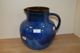 An early 20th Century Denby Danesby Ware ribbed jug in the 'Electric Blue' glaze, having painted