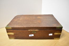 A Victorian mahohany brass bound stationary or table box with lozenge escutcheon and containing