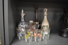 A mid-20th Century hand painted glass lemonade set, and three decanters, to include a Bohemian style
