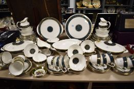 A Royal Doulton 'Carlyle' patterned dinner service (78 pieces) having a bottle green banded design