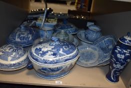 A Chinese blue and white pottery baluster vase and cover, cracked ice and prunus pattern with foo
