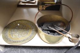 A 19th century brass jam pan of traditional design and filled with coal, sold along with a brass