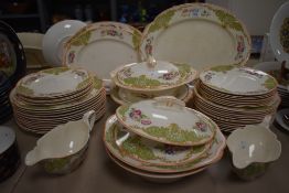 A Johnson Brothers Pareek pattern China part dinner service having orange edging and green a pink