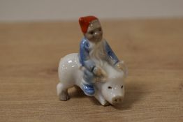 A scarce Wade whimsie, depicting tiny elf riding a pig.