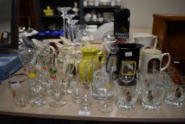 An assortment of breweriana comprising of a Kendal studio pottery small pitcher in a mustard