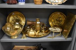 A selection of vintage brass and copperware, to include nautical themed embossed plates, a 'Bless