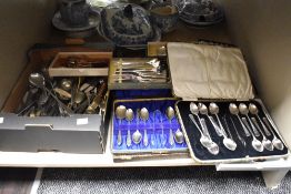 A cased canteen of silver plated Art Deco teaspoons and sugar nips, plus other cases of cutlery