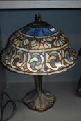 An attractive 20th Century Tiffany style stained glass lamp, of Art Nouveau style, the shade