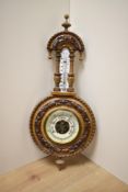 A Victorian walnut aneroid wheel barometer, measuring 40cm high