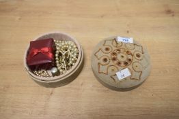 A mid-20th Century embroidered circular lidded jewellery box containing a selection of costume
