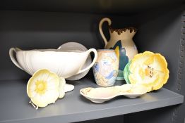An Art Deco Beswick Ware jug, hand decorated in a Clarice Cliff style pattern and measuring 28cm
