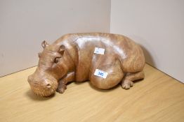 A 20th Century carved hardwood hippopotamus study, measuring 40cm long