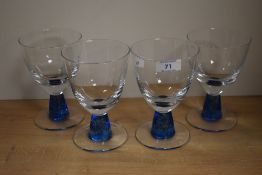 A group of four Denby Blue Jetty water goblets, each measuring 15cm high