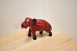 A small Royal Doulton fine bone china Flambe glazed elephant figure HN891A, having possible
