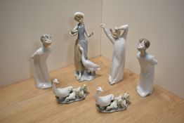 A group of Lladro porcelain figurines and ornithological groups, comprising three bedtime figures, a
