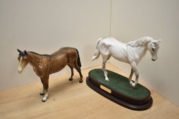 A Royal Doulton Desert Orchid porcelain horse figure on raised wooden base sold along with a Royal