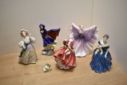 A group of five Royal Doulton comprising Grand Manner HN2723, Adrienne HN2304, May HN2746, Isadora