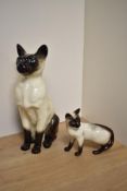 A Beswick Pottery Fireside Siamese cat study, modelled seated, No2139 sold along with a Beswick