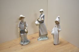 A group of three Lladro porcelain figures and figurines, comprising Gone Fishing, Girl with