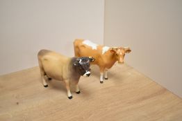 A Beswick Pottery Jersey Bull No1422 sold together with a Beswick Pottery Guernsey Cow No1248A (