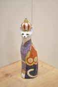 A Royal Crown Derby bone china Royal Cats Abyssinian paperweight, decorated with a stylised Imari