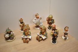 A group of nine Goebel porcelain figures and figurines, to include 'Friends' (girl and fawn) 'Little