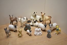 A mixed group of Beswick Pottery animal figures including Pot-Bellied goat, Siamese Cat No1558 and