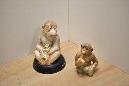 Two Beswick Pottery figures, Monkey on black glazed pottery base No397 and a pipe smoking Chimpanzee