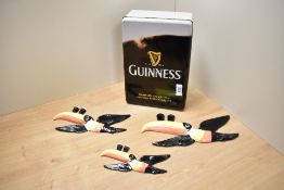 A set of three Carlton Ware 'Guinness' flying Toucan wall plaques, each of iconic design and