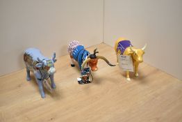A group of three decorative 'Cow Parade' studies, comprising Lowry Cow, Highland Cow (resin) and