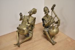 A pair of Nigerian (Benin) brass musician figures, one seated the other modelled playing a harp type