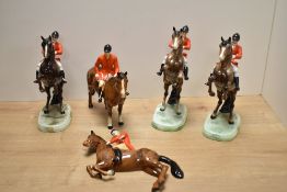 Four Beswick Pottery huntsman figures, three on rearing horses, sold along with a Beswick pottery